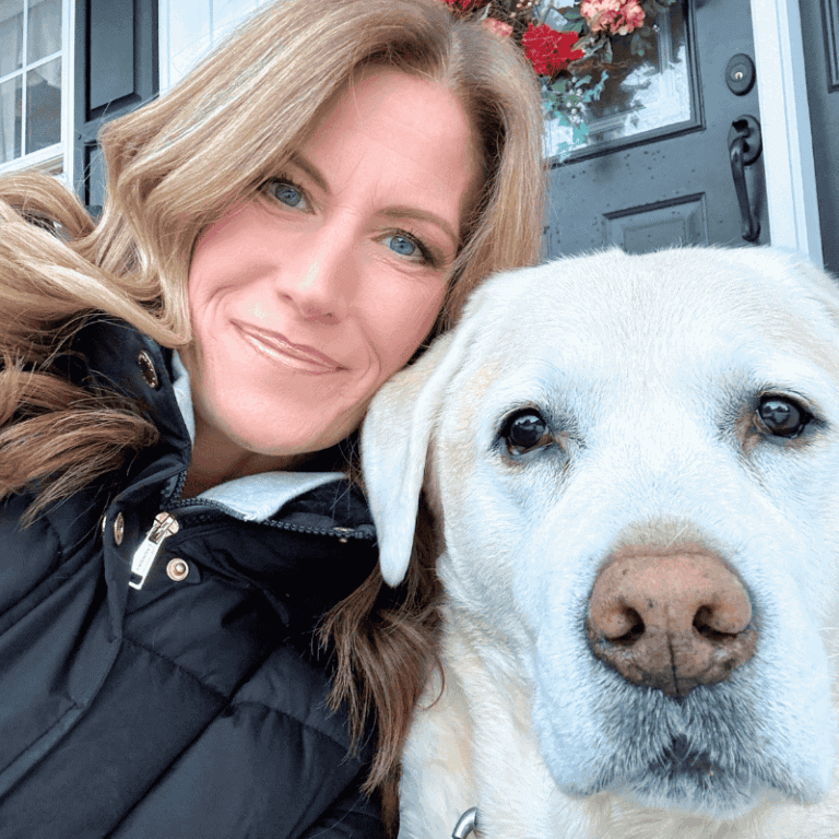 close up photo of the faces of the author and her yellow Labrador retriever